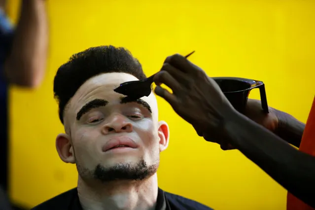 A participant receives a beauty treatment before the Mr & Miss Albinism Kenya Beauty Pageant 2018 in Nairobi, Kenya, November 30, 2018. (Photo by Baz Ratner/Reuters)