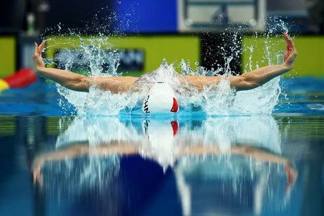 Zhang Yufei’s perfect form is reflected in the waters of the Aquatic Sports Arena in Hangzhou, China on September 27, 2023. The Chinese swimmer won the 100m butterfly final in an Asian Games record time of 55.86 seconds. (Photo by Marko Djurica/Reuters)
