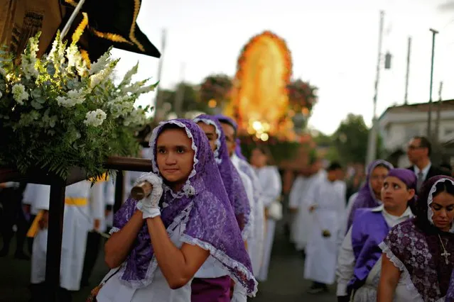 Catholic faithful participate in a procesion during the celebration of the Day of the Virgin of Guadalupe outside the Basilica of Guadalupe in San Salvador, El Salvador December 11, 2018. (Photo by Jose Cabezas/Reuters)