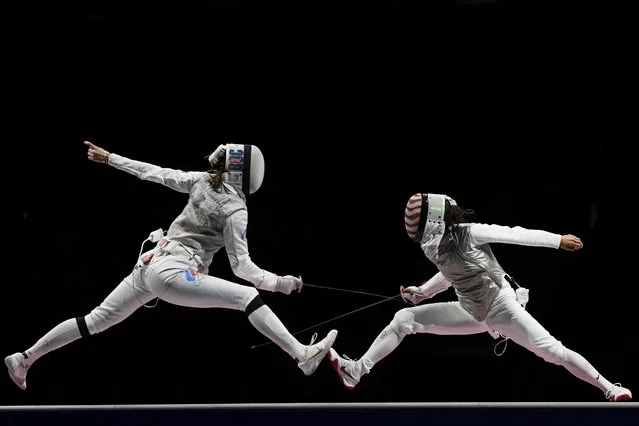 Lee Kiefer of Team United States (R) competes against Larisa Korobeynikova of Team ROC (L) in the Women's Foil Individual Fencing semifinal 2 on day two of the Tokyo 2020 Olympic Games at Makuhari Messe Hall on July 25, 2021 in Chiba, Japan. (Photo by Annegret Hilse/Reuters)