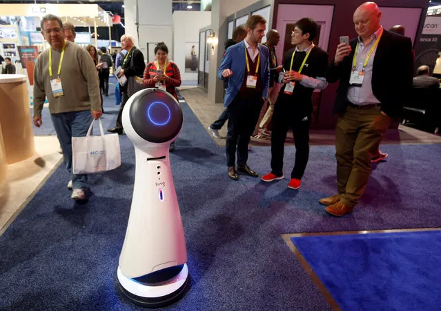 Wavebot, a service robot by Ling, travels down an aisle on the trade show floor during the 2017 CES in Las Vegas, Nevada January 6, 2017. (Photo by Steve Marcus/Reuters)