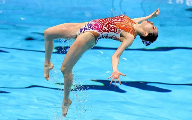 A member of the China team competes in the Artistic Swimming Team Free Routine on day fifteen of the Tokyo 2020 Olympic Games at Tokyo Aquatics Centre on August 7, 2021 in Tokyo, Japan. (Photo by Bernadett Szabo/Reuters)