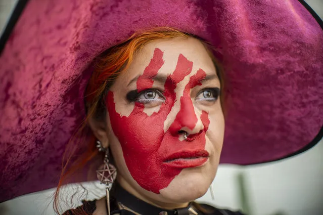 A woman with her face painted takes part in a protest against gender violence and femicides in Mexico City on February 2, 2019. (Photo by Pedro Pardo/AFP Photo)
