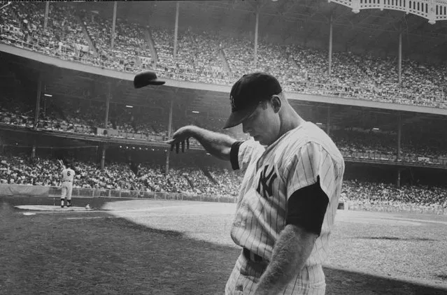 Yankee Mickey Mantle flinging his batting helmet away in disgust during bad day at bat, on June 25, 1965. (Photo by John Dominis/The LIFE Picture Collection/Getty Images)