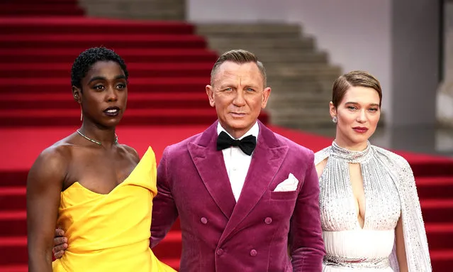 Lashana Lynch, from left, Daniel Craig and Lea Seydoux pose for photographers upon arrival for the World premiere of the new film from the James Bond franchise “No Time To Die”, in London Tuesday, September 28, 2021. (Photo by Matt Dunham/AP Photo)
