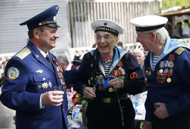 World War Two veterans (C, R) take part in the celebrations for the Victory Day in Moscow, Russia, May 9, 2015. (Photo by Maxim Zmeyev/Reuters)