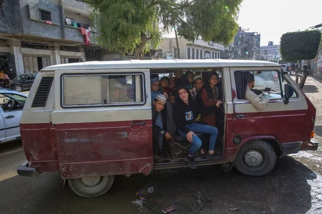 Palestinian school boys seen in a mini van on their way home from school in Jabalya refugee camp on November 11, 2021. (Photo by Ahmed Zakot/SOPA Images/Rex Features/Shutterstock)