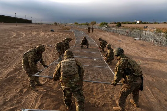 U.S. National Guard troops install new fencing at the U.S.-Mexico border to prevent migrants from crossing the Rio Grande River into El Paso, Texas on April 2, 2024. (Photo by Cheney Orr/Reuters)