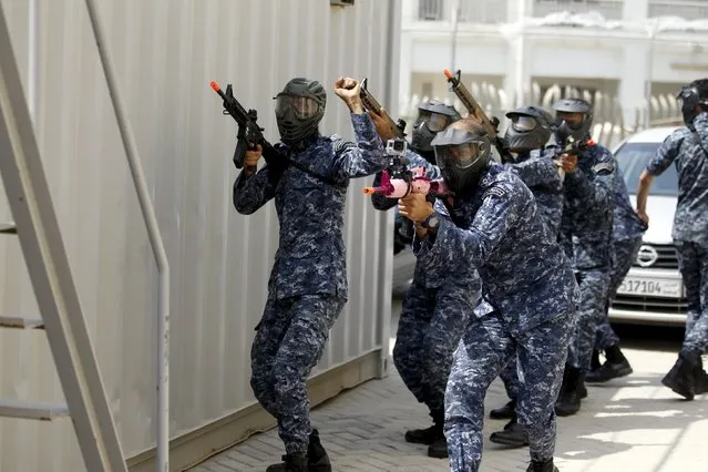 Bahraini Royal Navy special task force show their skills during a media demonstration for the International Mine Countermeasures Exercise (IMCMEX) at the Bahrain Naval Support Unit, Fifth Fleet Command centre in Manama, Bahrain April 9, 2016. (Photo by Hamad I. Mohammed/Reuters)