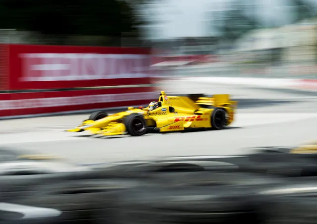 Ryan Hunter-Reay, of the United States, makes a corner during practice for the IndyCar auto race Saturday, June 13, 2015, in Toronto. (Nathan Denette/The Canadian Press via AP)