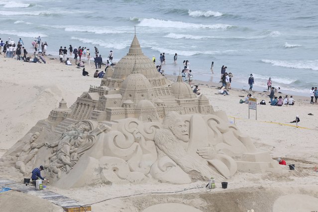 A person sculpts a sandcastle at Haeundae Beach in Busan, 320 kilometers southeast of Seoul, South Korea, 06 May 2024, on the final day of a long weekend due to the Children's Day holiday. (Photo by Yonhap/EPA)