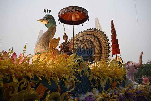 Miss Universe Thailand 2023 Anntonia Porsild sits atop a float during a parade to celebrate the upcoming Thai New Year, locally known as Songkran, in Bangkok on April 11, 2024. (Photo by Lillian Suwanrumpha/AFP Photo)