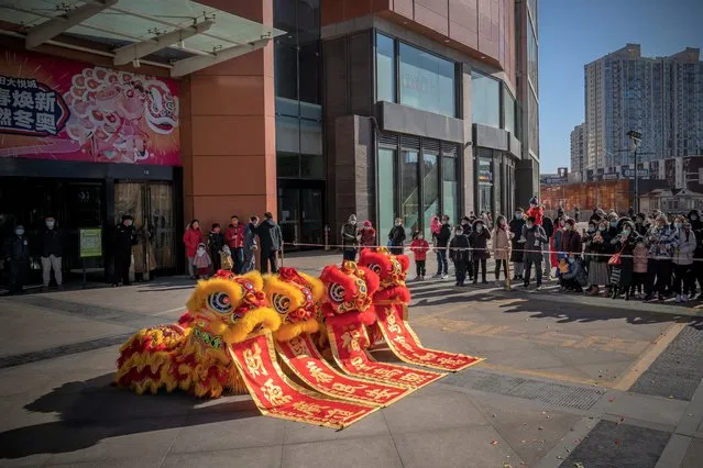 A lion dance is performed as China marks the first day of the Year of the Tiger on February 01, 2022 in Beijing, China. The Lion Dance is a traditional dance often performed to celebrate the Lunar New Year, in order to bring good luck and fortune. (Photo by Andrea Verdelli/Getty Images)