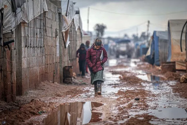 A general view as mud covers the refugee camp at the Syrian-Turkish border after heavy rain caused flood damaging their camp in Idlib, Syria on January 19, 2022. (Photo by Muhammed Said/Anadolu Agency via Getty Images)