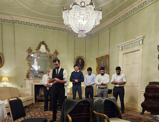 Newly confirmed Scottish First Minister Humza Yousaf leads his family in Muslim prayer during their first night at Bute House after breaking fast together during Ramadan, following his win at the Scottish National Party leadership election, in Edinburgh, Scotland, Britain on March 28, 2023 in this handout image. (Photo by Humza Yousaf/Handout via Reuters)