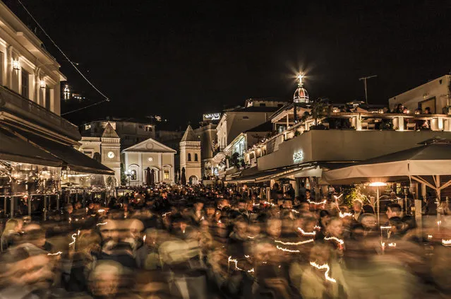 Runner-up. “This flurry of motion is a midnight Easter procession in Zakynthos Town, on the Ionian island of Zakynthos, Greece. The congregations of various churches return to their homes carrying candles”. PAUL GOLDSTEIN, JUDGE: “This has terrific energy, is a gorgeous taupe colour and the slow shutter speed is masterly. This technique is often abused but works beautifully with the candles and the one face sharp in the melee. An accomplished image”. (Photo by Dominic Vacher/GuardianWitness)
