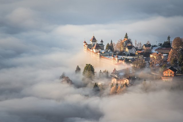 On the Top of the World. Photographer Boukhechina Malik describes his image: “The shot is the result of a magical, powerful instant seen from the top of Sonchaux, Switzerland, a day when the clouds were particularly low. I thought I was like emerged in a fairytale, out of every human scale”. (Photo by Boukhechina Malik/National Geographic Travel Photographer of the Year Contest)