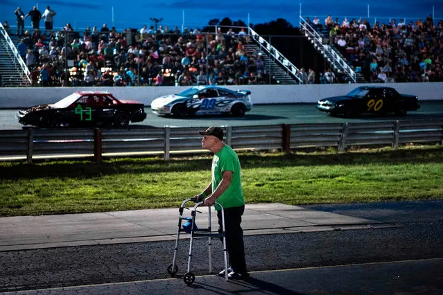 A man watches the race at Ace Speedway in Alamance County on May 19, 2017 in Altamahaw, North Carolina. (Photo by Brendan Smialowski/AFP Photo)