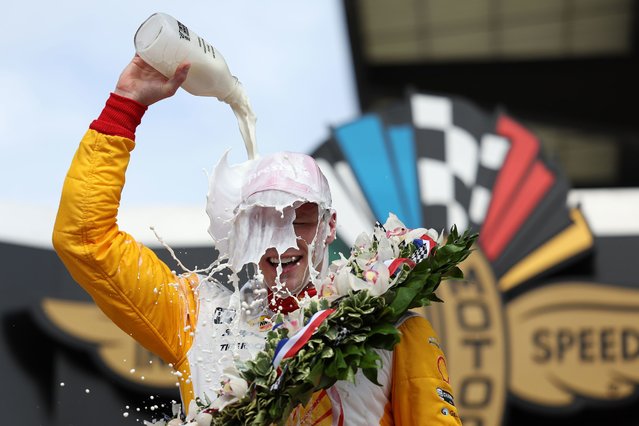 Josef Newgarden, driver of the #2 PPG Team Penske Chevrolet, celebrates by pouring milk on his head after winning the 107th Running of Indianapolis 500 at Indianapolis Motor Speedway on May 28, 2023 in Indianapolis, Indiana. (Photo by James Gilbert/Getty Images)