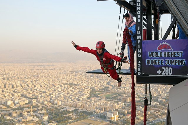 A view of the world's highest 280-meter bungee jumping platform opened at the Milad Tower, a landmark in the Iranian capital Tehran, on September 11, 2024. The world's highest bungee jumping platform attracts great interest among the younger generation in Iran, especially women. Those who jump from the platform experience an unforgettable adventure with the thrill of soaring down from a height of 280 meters while watching the view of Tehran from above. (Photo by Fatemeh Bahrami/Anadolu via Getty Images)