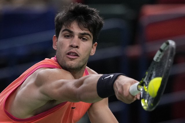 Carlos Alcaraz of Spain plays a backhand return against Tomas Machac of the Czech Republic during the men's singles quarterfinals match in the Shanghai Masters tennis tournament at Qizhong Forest Sports City Tennis Center in Shanghai, China, Thursday, October 10, 2024. (Photo by Andy Wong/AP Photo)