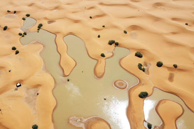 A view of lakes caused by heavy rainfall between sand dunes in the desert town of Merzouga, near Rachidia, southeastern Morocco, Wednesday, October 2, 2024. (Phoot by AP Photo/Stringer)