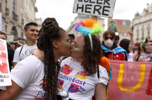 Members of the Lesbian, Gay, Bisеxual and Transgender (LGBT+) community take part in the annual Pride Parade on July 02, 2022 in London, England. The first Gay Pride march to be held in a UK city took place from Hyde Park to Trafalgar Square, London on 1 July 1972 and was a carnival parade of protest against the inequalities suffered by LGBTQ+ people at the time. Attended by around 500 people, the event was heavily policed and a far cry from the tens of thousands of people who take part now, fifty years on. Although in recent years the Metropolitan police have paraded in uniform as part of the march, this year there have been calls for them not to attend, this is in part due to the botched investigation of the murders of four gay men by serial killer Stephen Port. (Photo by Hollie Adams/Getty Images)