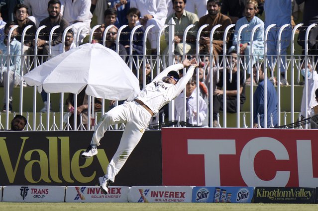 Pakistan's Saim Ayub jumps but fails to take a catch from a shot by England's Jamie Smith on the boundary edge during day one of the third test cricket match between Pakistan and England, in Rawalpindi, Pakistan, Thursday, October 24, 2024. (Photo by Anjum Naveed/AP Photo)