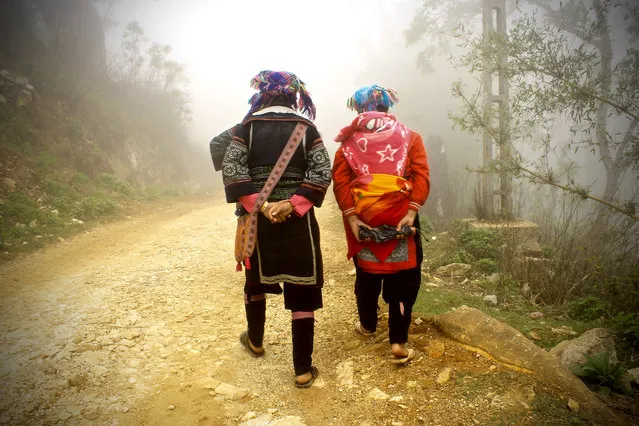 “Hmong ladies walking me to the village of Tivan, in Sapa. During my four-week trip to Vietnam I spent three days at one of the hill tribe’s homestays, and it was one of the best experiences I had in Vietnam”. (Photo by Giulia Ghinelli/The Guardian)