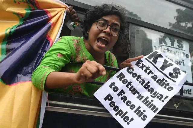 A demonstrator shouts slogans after being detained by police personnel during a protest in solidarity with the people of Sri Lanka, outside the Sri Lankan embassy in New Delhi on July 14, 2022. (Photo by Money Sharma/AFP Photo)