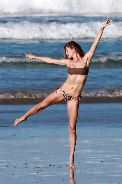 Gisele Bundchen retired from runway modeling in 2015 but the Brazilian bombshell proved she still is very much a supermodel during a photo shoot on the beach in Costa Rica on March 13, 2020. Gisele looks great as she shows off her toned figure while frolicking on the beach in a chocolate covered bikini top with matching leopard print bottom. (Photo by Backgrid USA)