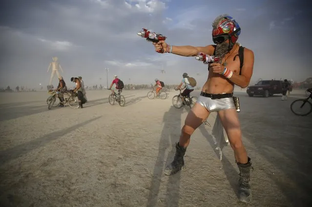 Dillon Bracken attends the Burning Man 2014 “Caravansary” arts and music festival in the Black Rock Desert of Nevada, August 30, 2014. (Photo by Jim Urquhart/Reuters)
