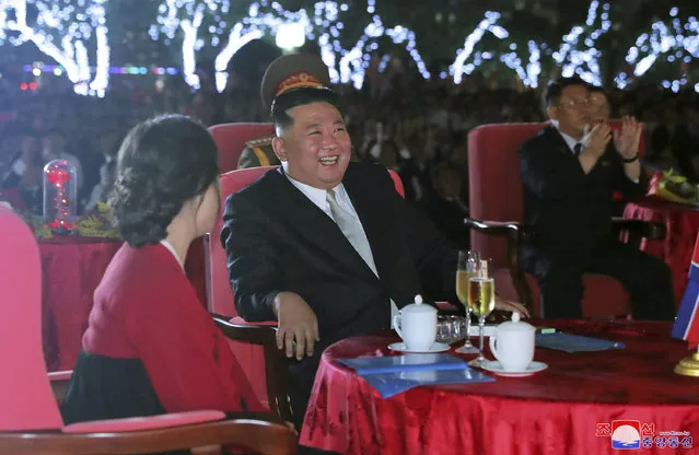 This photo provided by the North Korean government shows North Korean leader Kim Jong Un, center, and his wife Ri Sol Ju, left, watch a performance during a celebration marking the nation's 74th anniversary in Pyongyang, North Korea, on September 8, 2022. Independent journalists were not given access to cover the event depicted in this image distributed by the North Korean government. The content of this image is as provided and cannot be independently verified. (Photo by Korean Central News Agency/Korea News Service via AP Photo)