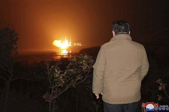 In this photo provided by the North Korean government, North Korean leader Kim Jong Un watches a rocket launch from a launching center in North Korea, Tuesday, November 21, 2023. The North’s space agency said that its new “Chollima-1” carrier rocket accurately placed the Malligyong-1 satellite into orbit on Tuesday night. Independent journalists were not given access to cover the event depicted in this image distributed by the North Korean government. The content of this image is as provided and cannot be independently verified. Korean language watermark on image as provided by source reads: “KCNA” which is the abbreviation for Korean Central News Agency. (Photo by Korean Central News Agency/Korea News Service via AP)