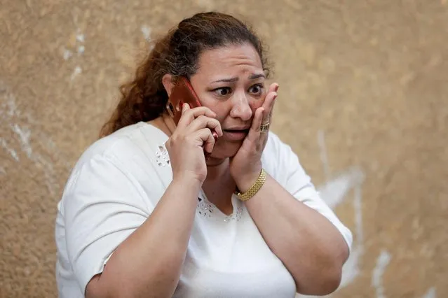 A woman reacts after a deadly fire broke out at the Abu Sifin church, in Giza, Egypt on August 14, 2022. (Photo by Mohamed Abd El Ghany/Reuters)