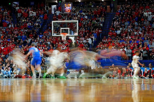 The Louisville Cardinals and Creighton Bluejays during their NCAA Tournament first round basketball game at Rupp Arena in Lexington, Kentucky on March 20, 2025. (Photo by Aaron Doster/Imagn Images/Reuters)