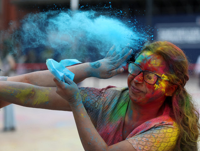 A student is covered in coloured powder during Holi festivities at Liverpool University in Liverpool, Britain, on March 16, 2025. (Photo by Phil Noble/Reuters)