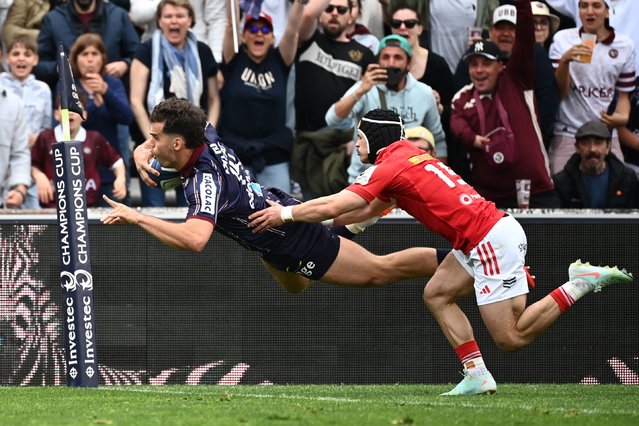 Bordeaux-Begles' French wing Damian Penaud dives across the line to score a try during the European Rugby Champions Cup quarter final rugby union match between Union Bordeaux-Begles (UBB) and Munster at the Stade Jacques Chaban-Delmas in Bordeaux, southwestern France, on April 12, 2025. (Photo by Christophe Archambault/AFP Photo)