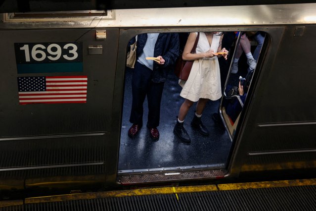 People wait for a subway train to depart Union Square station, in New York City on June 1, 2025. (Photo by Kevin Coombs/Reuters)
