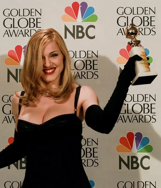 Madonna poses backstage at the 54th Annual Golden Globes at the Beverly Hilton Hotel in Beverly Hills, Calif., Sunday, January 19, 1997. Madonna won the award for best actress in a musical or comedy for “Evita”. (Photo by Reed Saxon/AP Photo)