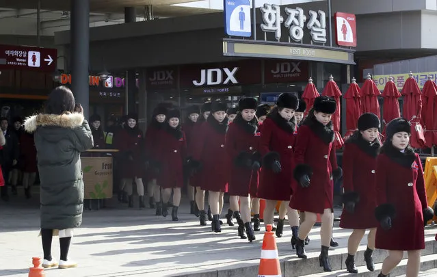 North Korean cheering squads leave an expressway service in Gapyeong, South Korea, Wednesday, February 7, 2018. A North Korean delegation, including members of a state-trained cheering group, arrived in South Korea on Wednesday for the Pyeongchang Winter Olympics. (Photo by Park Dong-ju/Yonhap via AP Photo)
