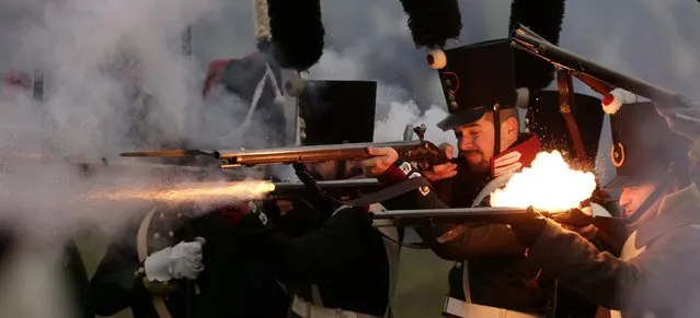 History enthusiasts, dressed as soldiers, fight during the re-enactment of Napoleon's famous battle of Austerlitz near the southern Moravian town of Slavkov u Brna November 29, 2014. (Photo by David W. Cerny/Reuters)