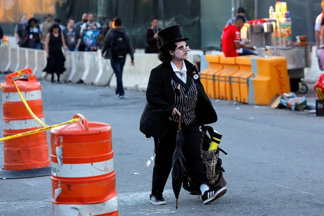 A person dressed as The Penguin leaves New York Comic Con in Manhattan, New York, U.S., October 8, 2016. (Photo by Andrew Kelly/Reuters)