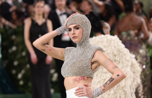 English model and actress Cara Delevingne poses at the Met Gala, an annual fundraising gala held for the benefit of the Metropolitan Museum of Art's Costume Institute with this year's theme “Sleeping Beauties: Reawakening Fashion” in New York City, New York, U.S., May 6, 2024. (Photo by Andrew Kelly/Reuters)