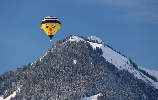 A balloon takes part in the 43rd International Hot Air Balloon Festival in Chateau-d'Oex, Switzerland on January 24, 2023. (Photo by Denis Balibouse/Reuters)