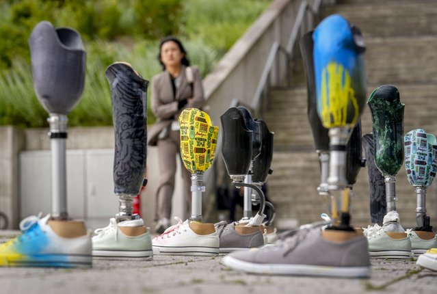Leg prosthesis are set up at the recovery conference in Berlin, Germany, Tuesday, June 11, 2024. Germany is hosting a conference to gather support for Ukraine's recovery from the destruction wreaked by Russia's war, sending a new signal of solidarity with Kyiv at the start of a week of intense diplomacy. (Photo by Ebrahim Noroozi/AP Photo)