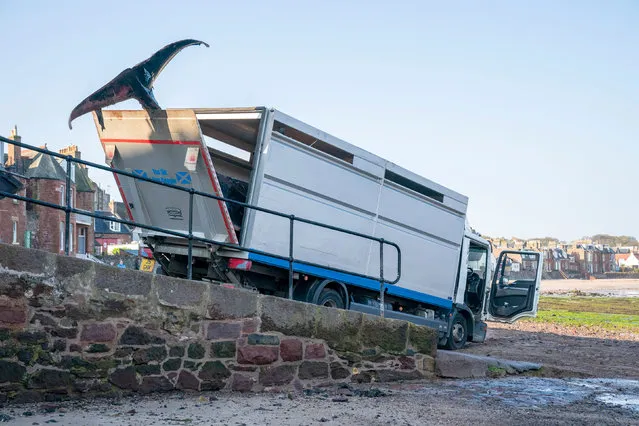 A dead minke whale which washed up on the West Bay beach in North Berwick, East Lothian, on Wednesday is taken away on Friday, April 21, 2023. The area around the whale has been cordoned off by police as the carcass is removed. (Photo by Jane Barlow/PA Images via Getty Images)