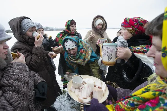 Villagers take part in Kolyada holiday celebrations in the village of Martsiyanauka, east of the capital Minsk, January 21, 2015. (Photo by Vasily Fedosenko/Reuters)