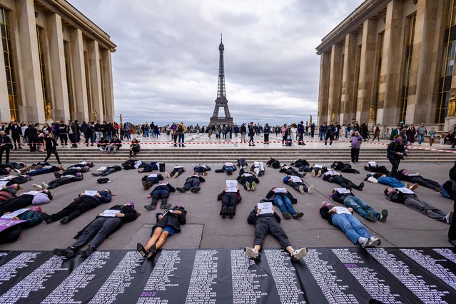 Members of the French women group “Nous Toutes” (all of us) lay on the ground with  placards reading the names of women killed by feminicide since the election of French President Macron, on the Place du Trocadero, near the Eiffel Tower, in Paris, France, 20 October 2024. Activists demand more government action against gender-based violence. (Photo by Christophe Petit Tesson/EPA/EFE)