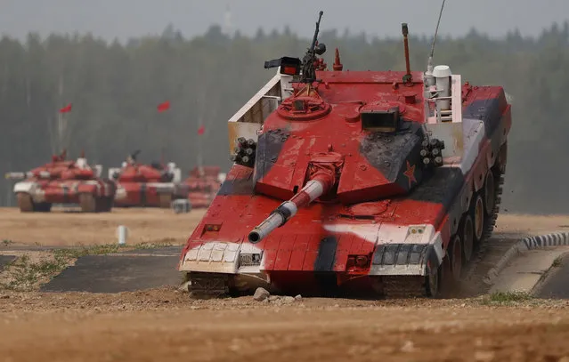 A tank operated by a crew from China drives during the Tank Biathlon competition at the International Army Games 2018, in Alabino outside Moscow, Russia on July 28, 2018. (Photo by Sergei Karpukhin/Reuters)